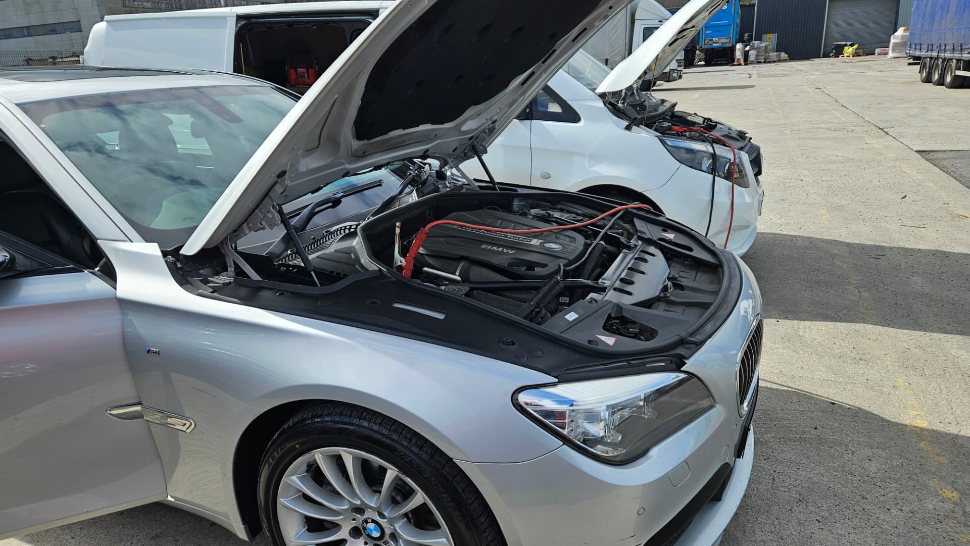 BMW 7 Series with bonnet up during mobile ECU remap in Belfast