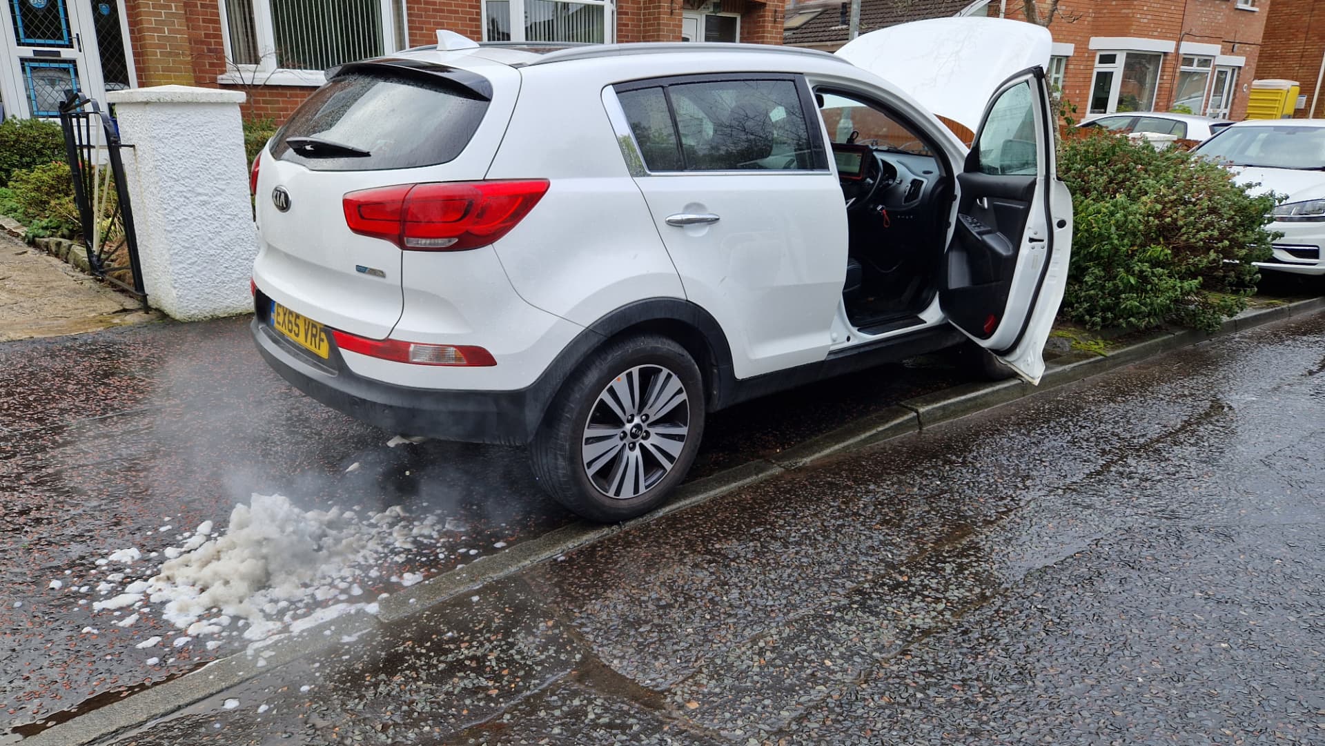 White Kia Sportage on a Belfast street during a mobile engine carbon clean